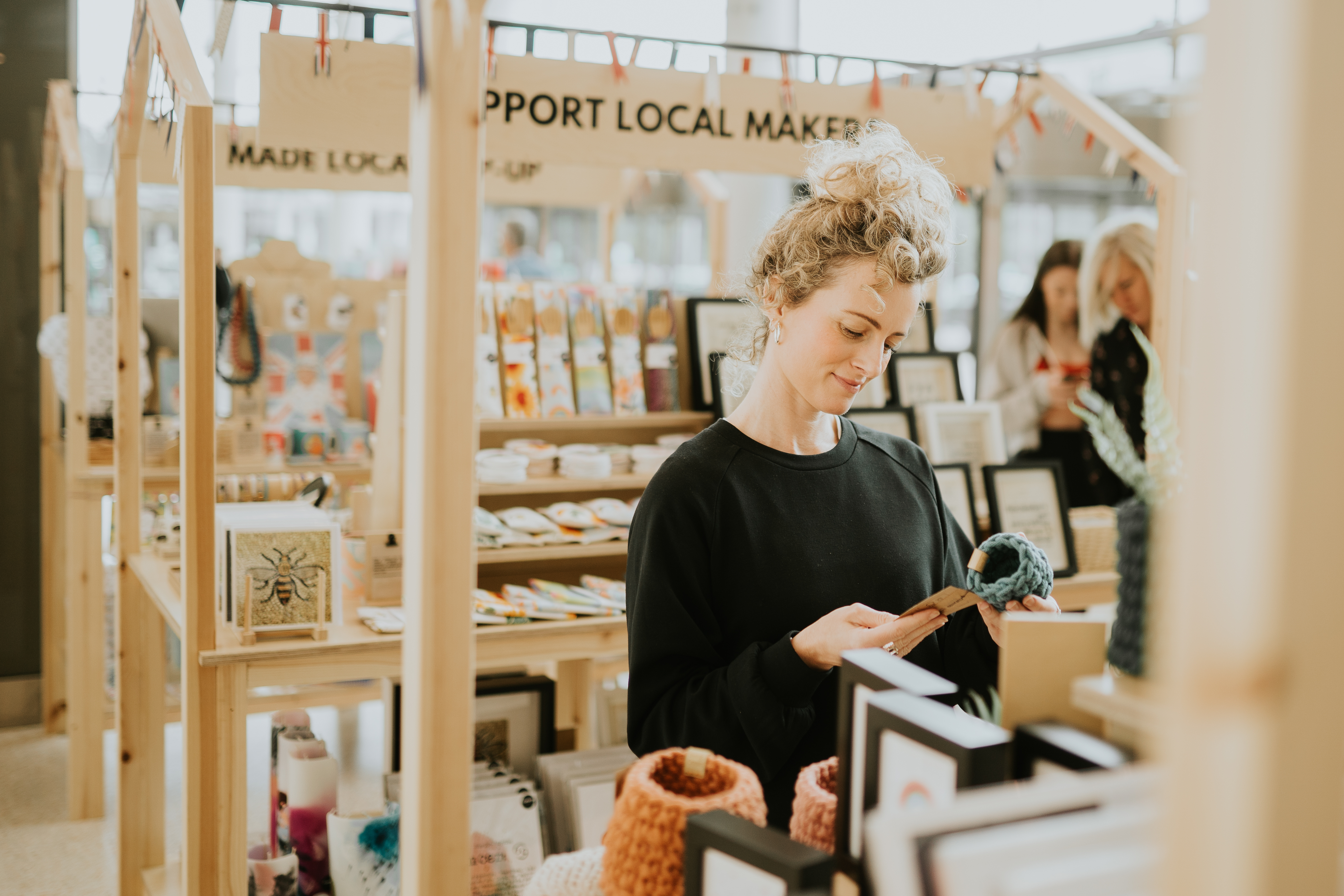 Curated Makers Team Member at the till 