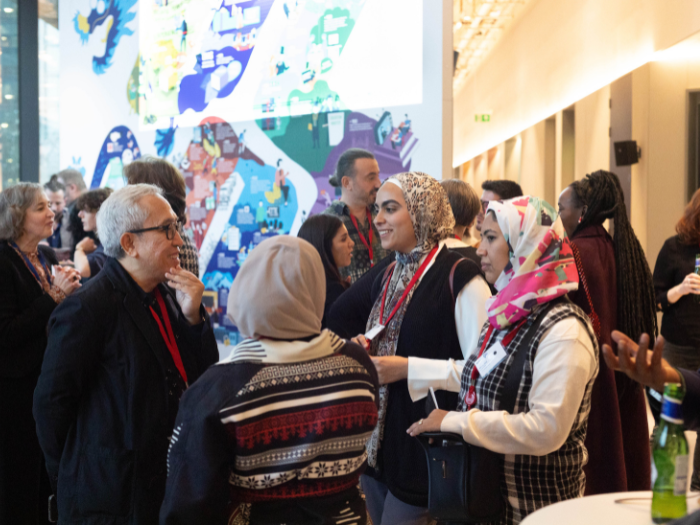 Delegates chatting at the conference 