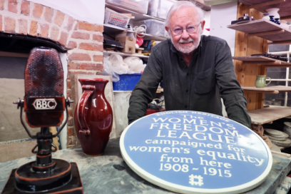 An image of Ned Haywood with a blue plaque 