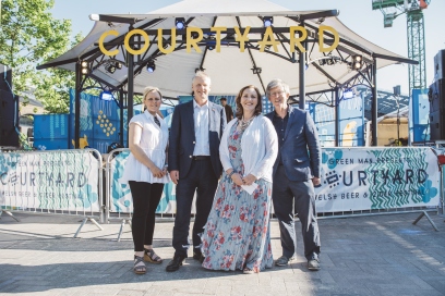 Sara Pepper, Colin Riordan, Fiona Stewart and Ian Hargreaves in front of Green Man banner