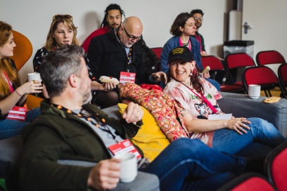 A group of people talking at a Creative Cardiff event.