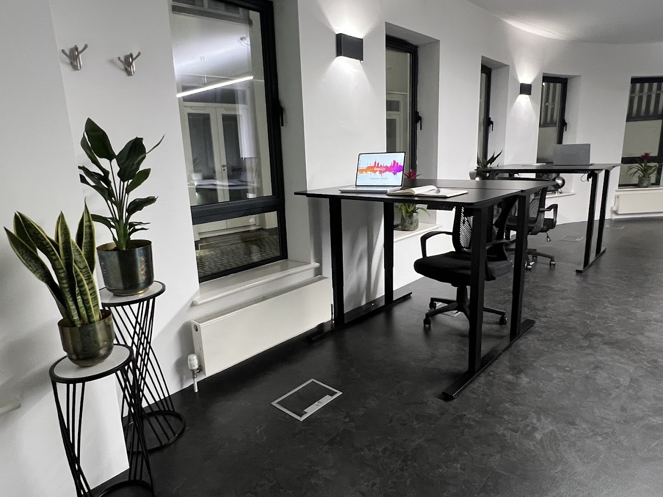 An image of two standing desks in the iungoworks coworking space