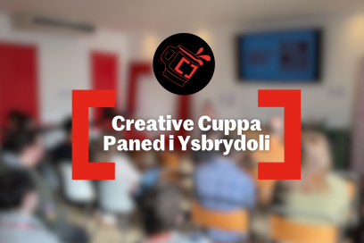 Blurred image of people sitting in a room with the Creative Cardiff creative cuppa logo in the middle